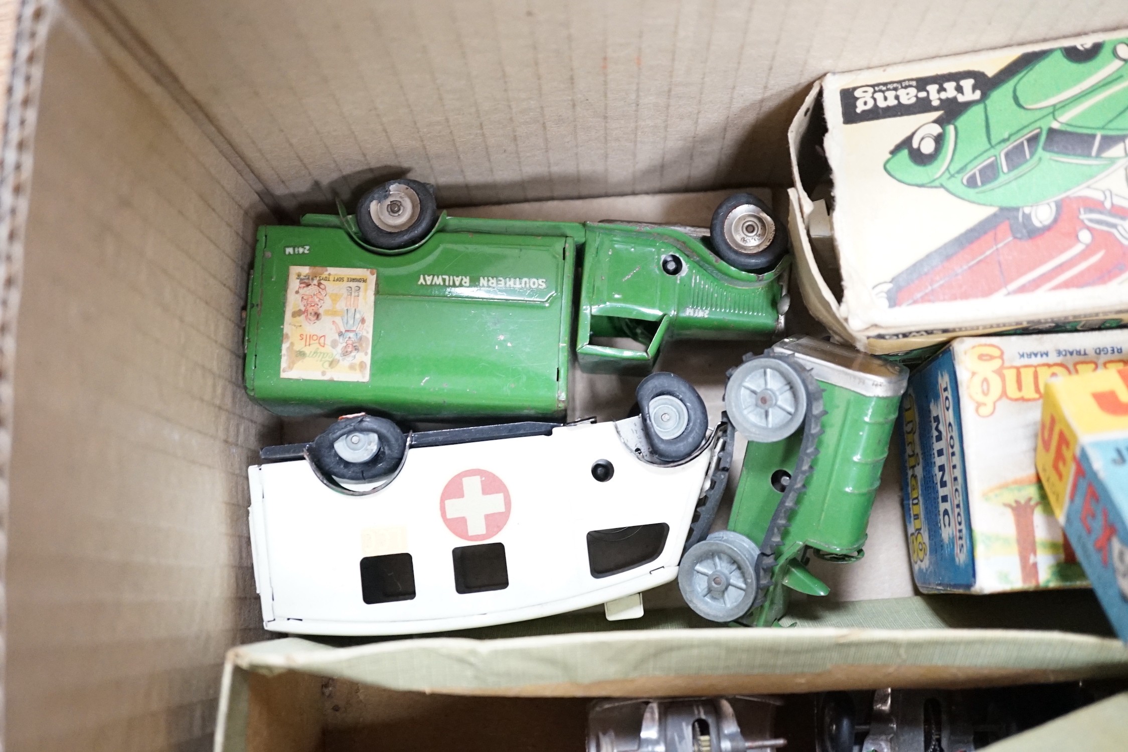 A collection of tin plate model vehicles, to include a boxed Tri-ang model of a Vauxhall Cabriolet & caravan from the Minic clockwork toys collection, and others
